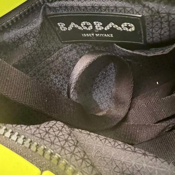 Issey miyake small crossbody bag. Measures—-11.25 by 7.5 height. - Picture 3 of 3